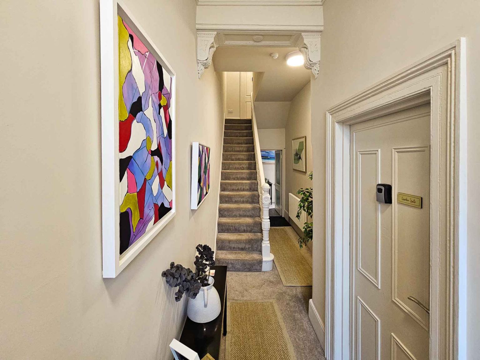 Entrance hallway at Crescent House with original artwork