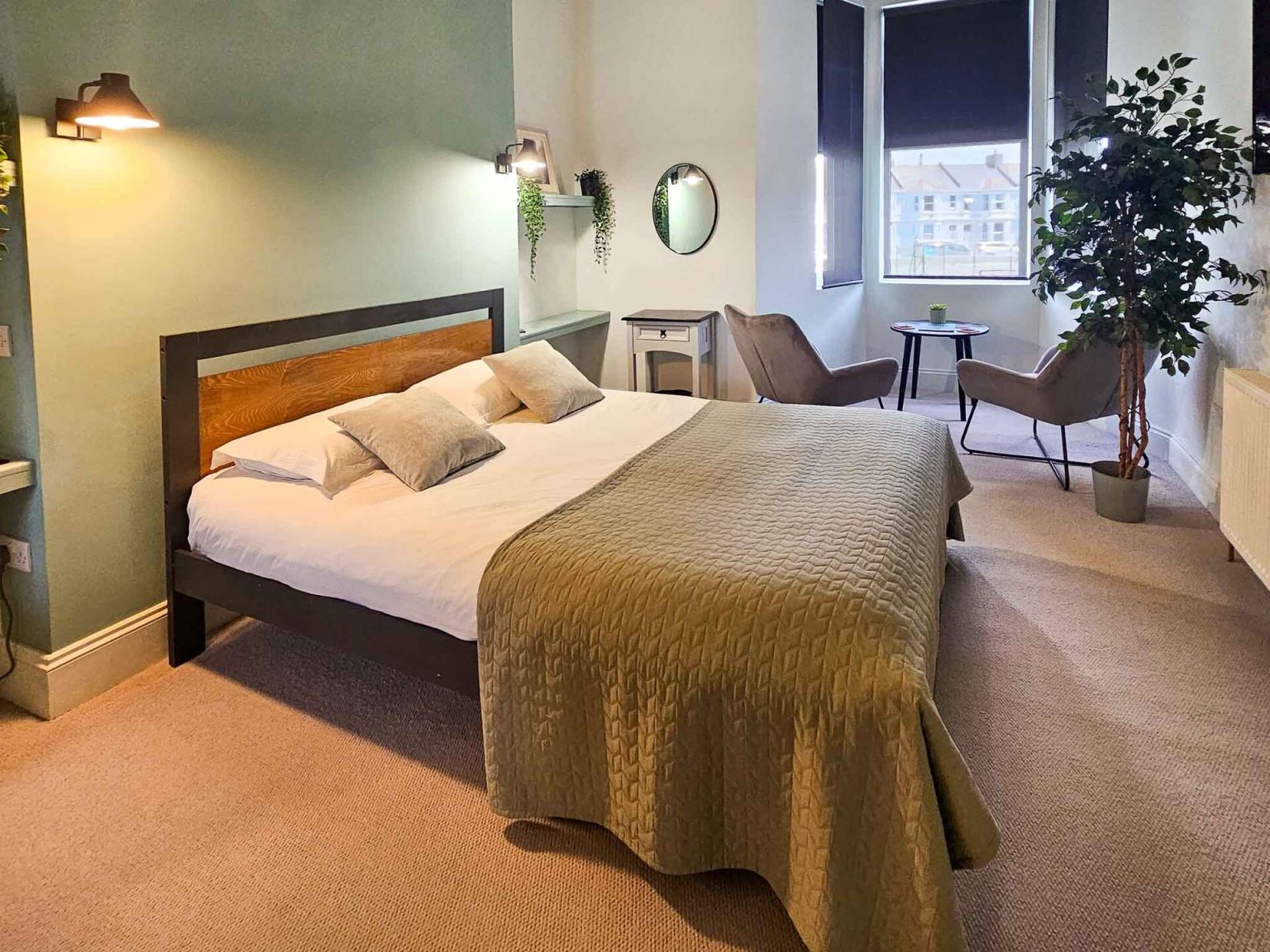 Willow Suite bedroom with sage feature wall